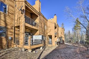 a large wooden house in the woods at Hot Tub and Mtn Views Silverthorne Escape! in Silverthorne