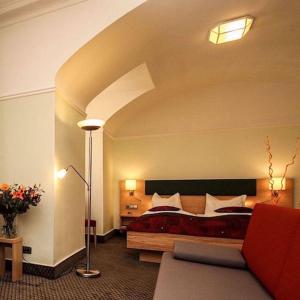 Postel nebo postele na pokoji v ubytování Hotel Barbara