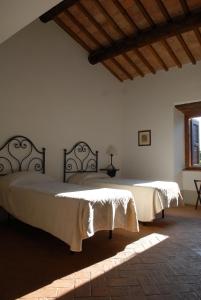 A bed or beds in a room at La Spinetta