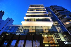 a tall building with a lot of windows at BIT Design Hotel in Montevideo