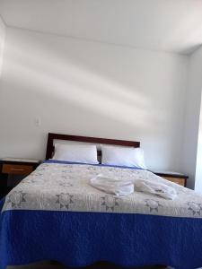 Postel nebo postele na pokoji v ubytování Hotel Prestigio JC
