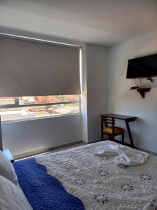 Postel nebo postele na pokoji v ubytování Hotel Prestigio JC