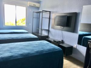 Cama ou camas em um quarto em Residencial Gralha Azul