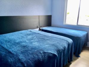 Cama ou camas em um quarto em Residencial Gralha Azul