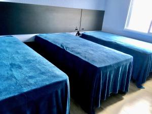 Cama ou camas em um quarto em Residencial Gralha Azul