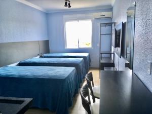 Cama ou camas em um quarto em Residencial Gralha Azul