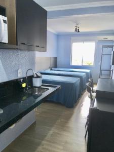 Cama ou camas em um quarto em Residencial Gralha Azul