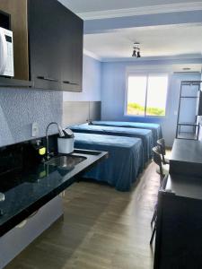 Cama ou camas em um quarto em Residencial Gralha Azul