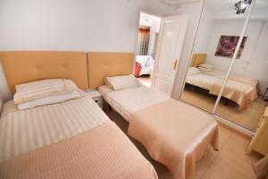 A bed or beds in a room at BENAL BEACH, Superb 2 Bedroom 2 Bathroom Beach front Apartment sleeps 6