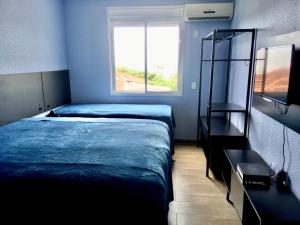 Cama ou camas em um quarto em Residencial Gralha Azul