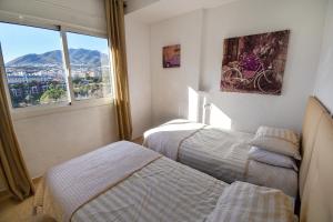 A bed or beds in a room at BENAL BEACH, Superb 2 Bedroom 2 Bathroom Beach front Apartment sleeps 6