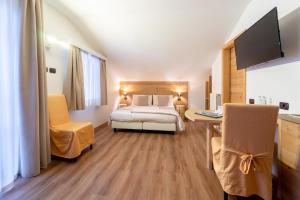 Voodi või voodid majutusasutuse Negritella Sweet Hotel toas