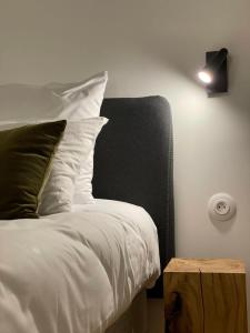 Postel nebo postele na pokoji v ubytování Appart Hôtel Victoria