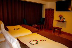 Voodi või voodid majutusasutuse Hotel Tara Machupicchu toas