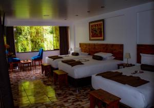 Voodi või voodid majutusasutuse Hotel Tara Machupicchu toas