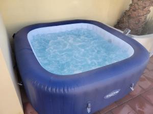 a large blue tub sitting next to a wall at Playa Hermosa Inn at the beach in Ensenada