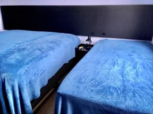 Cama ou camas em um quarto em Residencial Gralha Azul