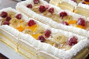 two cakes with fruit on top on a table at Bella Vista Beach Club - All Inclusive in Sinemorets