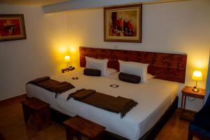 Voodi või voodid majutusasutuse Hotel Tara Machupicchu toas