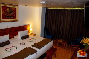 Voodi või voodid majutusasutuse Hotel Tara Machupicchu toas