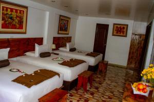 Voodi või voodid majutusasutuse Hotel Tara Machupicchu toas