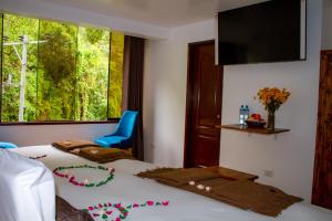Voodi või voodid majutusasutuse Hotel Tara Machupicchu toas