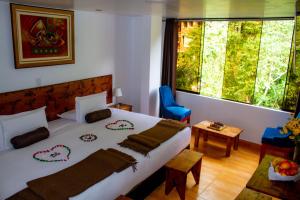 Voodi või voodid majutusasutuse Hotel Tara Machupicchu toas