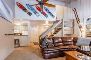 a living room with a couch and a ceiling fan at New Listing 2 bedroom and Loft 2 bath Summit E Bldg 16 condo sleeps 8 Steps to Eagle Lodge Chair 15 in Mammoth Lakes