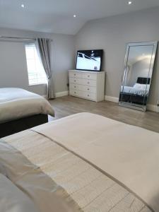 Voodi või voodid majutusasutuse Modern 3-Bed Apartment in Magherafelt Sleeps 8 toas