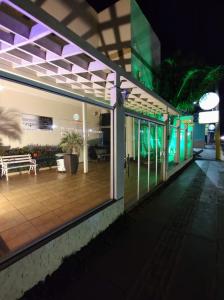 an outside view of a building at night at Pousada Tamandaré in Campo Grande