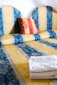 Tempat tidur dalam kamar di Residence Le Terrazze Sul Mare