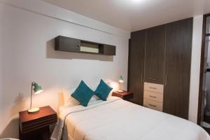Postel nebo postele na pokoji v ubytování Cozy Room Cusco