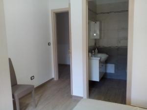 a small bathroom with a sink and a toilet at B & B La Magnolia in Specchiolla