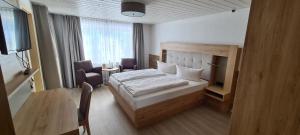 Postel nebo postele na pokoji v ubytování Hotel Anneliese