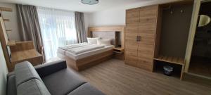 Postel nebo postele na pokoji v ubytování Hotel Anneliese