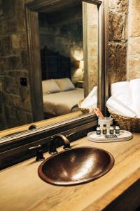 a bathroom with a sink and a mirror at The Inn at Zaca Creek in Buellton