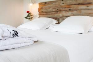 Łóżko lub łóżka w pokoju w obiekcie Hotel Boutique Elvira Plaza