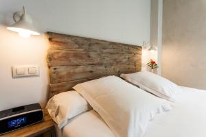 Łóżko lub łóżka w pokoju w obiekcie Hotel Boutique Elvira Plaza