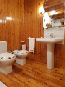 a bathroom with a toilet and a sink at Cal Ferrer del Querforadat in Cava +22 photos