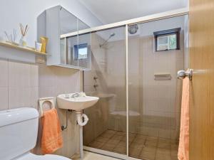 a bathroom with a shower and a sink at SeaEsta 10 Lewis Road Carrickalinga in Carrickalinga +21 photos