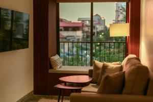 Posezení v ubytování La Chronique Hotel