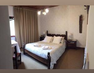 เตียงในห้องที่ Estancia Quillen Lodge - Hosteria