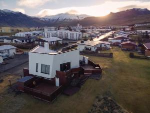 an aerial view of a small town with a house at Kirkjufell Oceanfront Villa in Grundarfjordur