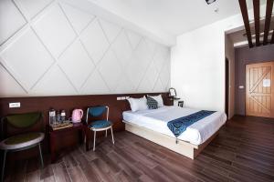 Giường trong phòng chung tại Toutsu Asami Guest House