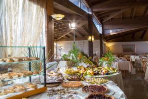 a table filled with lots of different types of food at Garden Hotel Ripa in Vieste