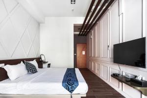 Giường trong phòng chung tại Toutsu Asami Guest House