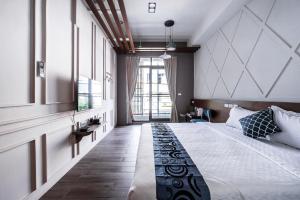 Giường trong phòng chung tại Toutsu Asami Guest House