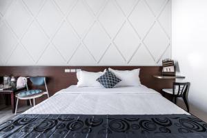 Giường trong phòng chung tại Toutsu Asami Guest House