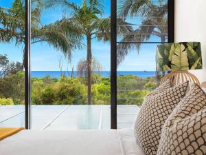 a living room with a view of the ocean at Your Luxury Escape - Kiah 11 Beach House Ocean views in Byron Bay
