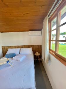 Una cama o camas en una habitación de Morada dos Açores - Casas à beira mar